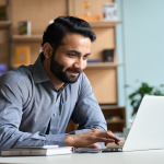 Male student on a laptop is ready to start learning