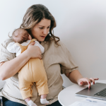 A mom filling out applications online