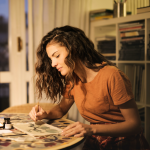 A woman finishing her studio art homework